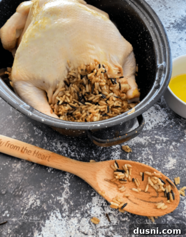 Effortless Wild Rice Stuffed Chicken 6 Baked chicken with wild rice stuffing on a plate, ready to serve.