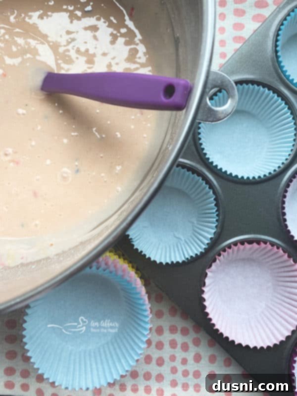 A stack of three bubblegum cupcakes