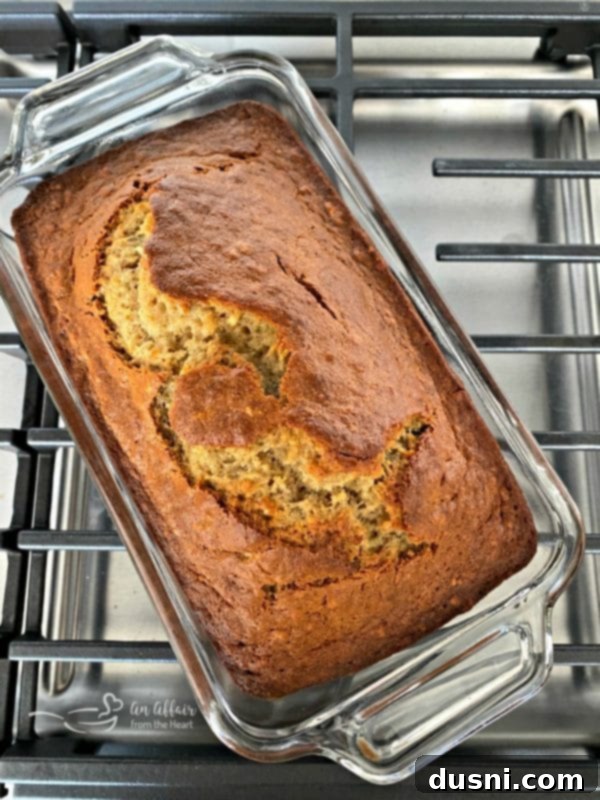 The Ultimate Banana Bread 5 Warm banana bread cooling on a wire rack, filling the kitchen with a sweet aroma
