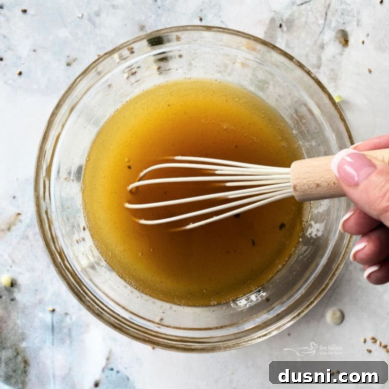 Stirring Chinese Salad Dressing ingredients in a bowl