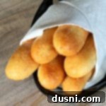 Freshly baked Olive Garden Breadsticks on a plate, hot and ready to serve