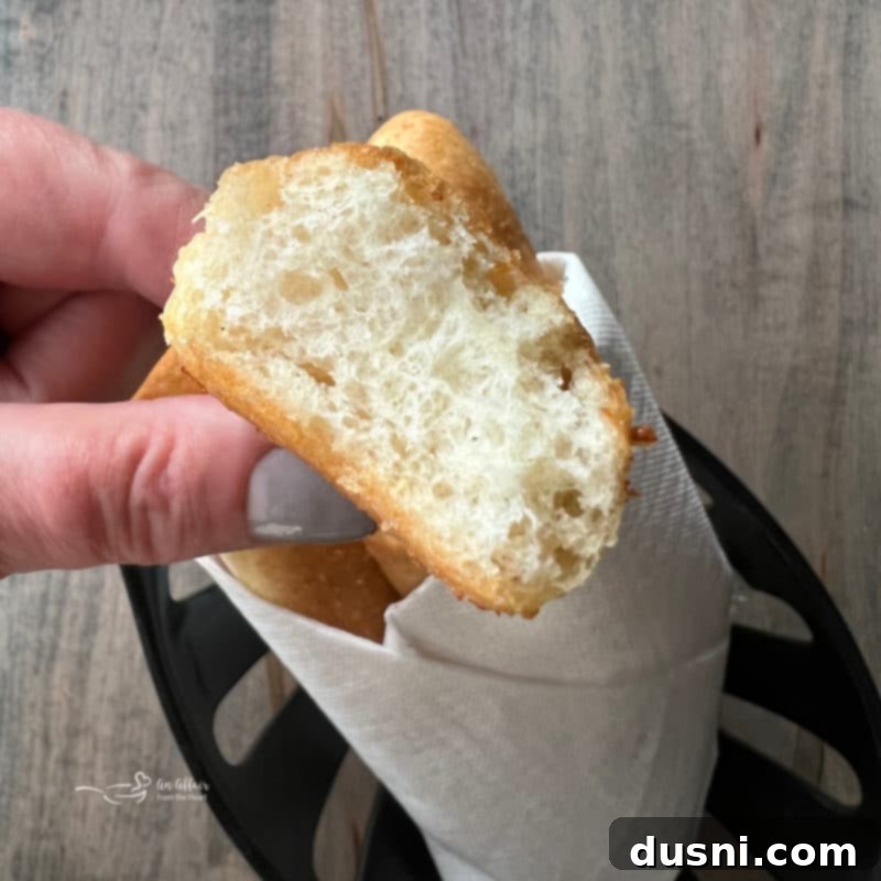 Pulled Apart Olive Garden Breadsticks, showcasing their fluffy interior