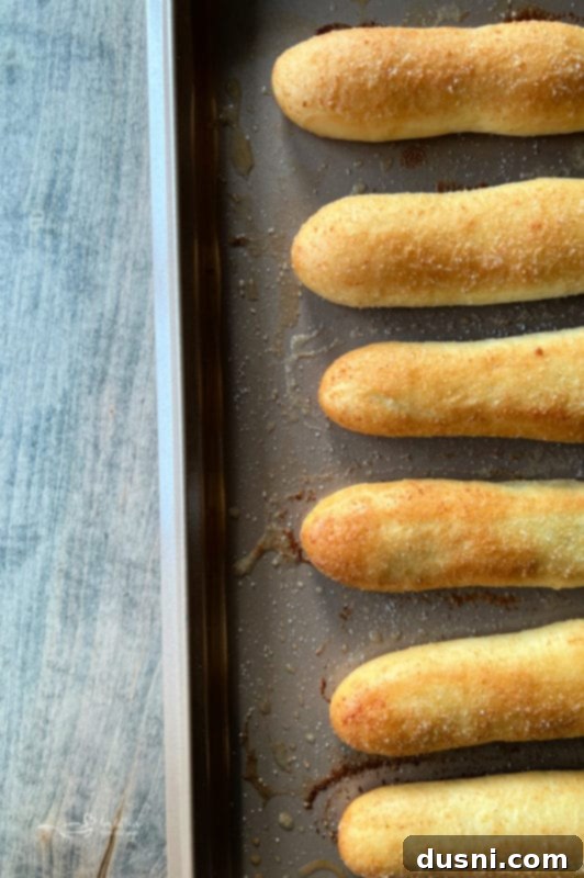 Baked Olive Garden Breadsticks, golden brown and glistening with butter