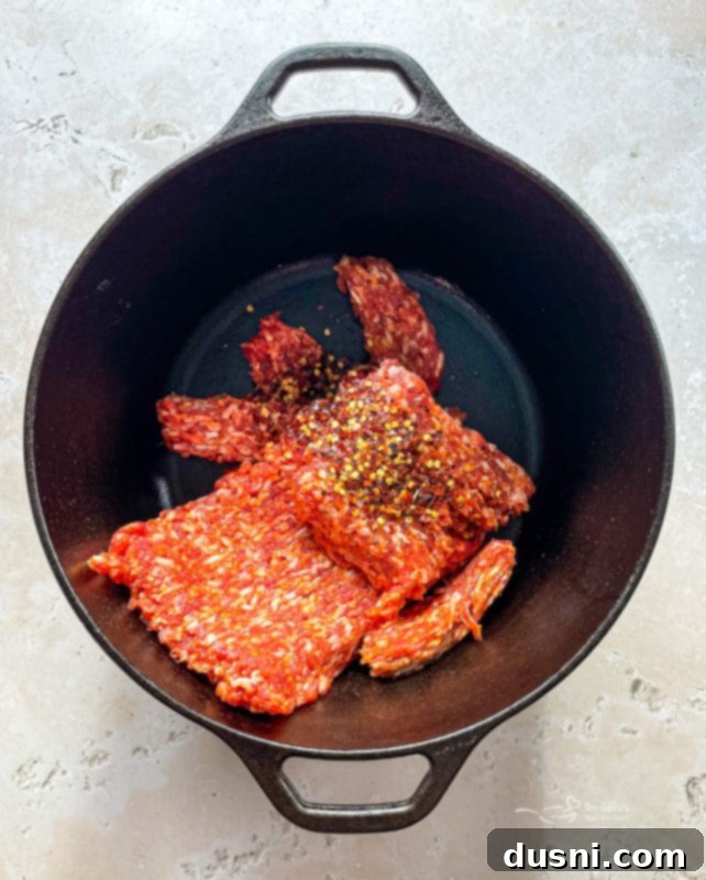 Sauté Italian sausage in Zuppa