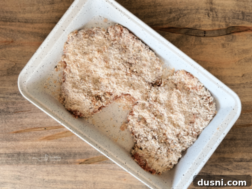 Coated chicken fried steak resting on a plate