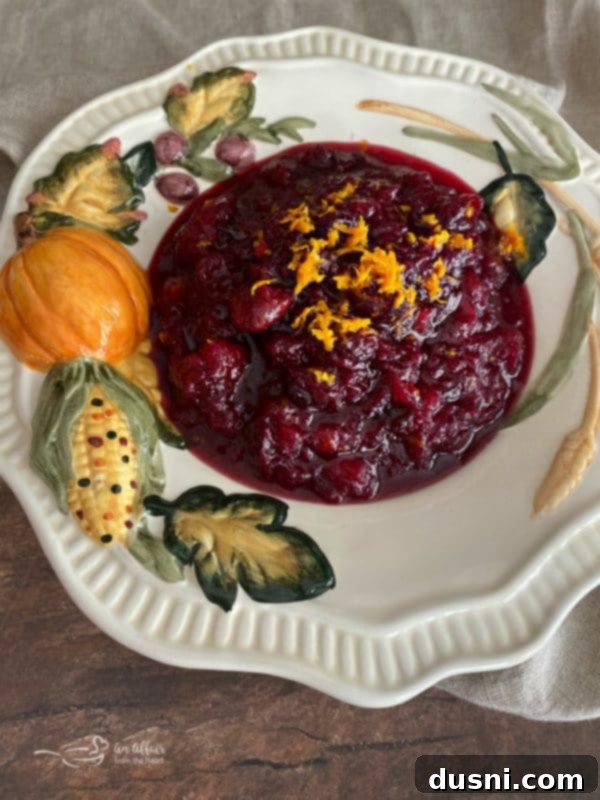 Mom's Homemade Cranberry Perfection 4 A vibrant, homemade cranberry sauce served in a decorative Thanksgiving bowl, ready to be enjoyed.