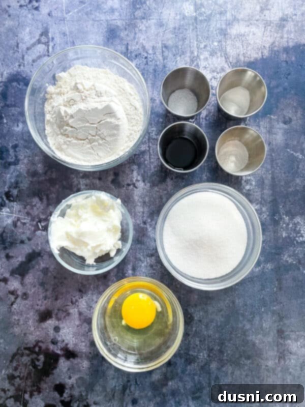 A selection of dry ingredients, including flour, sugar, and spices, laid out for baking.