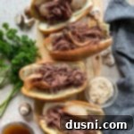 Mouthwatering Crock Pot French Dip Sandwiches 16 top view of four french dip sandwiches