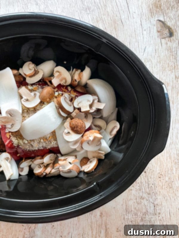 Mouthwatering Crock Pot French Dip Sandwiches 7 Ingredients for French dip in a Crockpot before cooking.