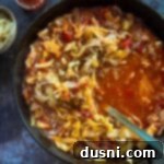 Classic Cabbage Roll Soup Made Two Ways 17 spooning out cabbage roll soup from the skillet