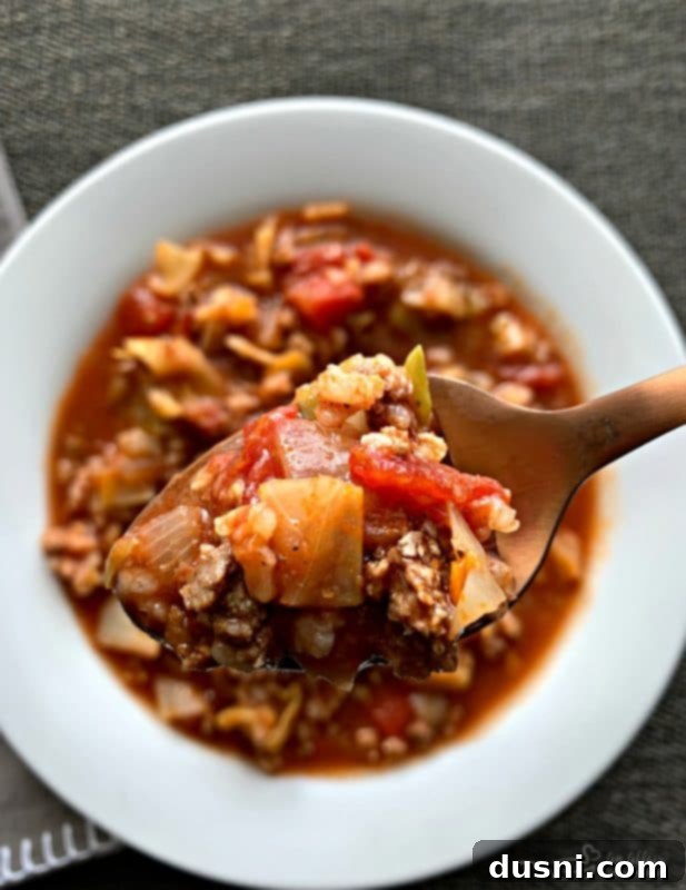 Classic Cabbage Roll Soup Made Two Ways 18 One Pot Cabbage Roll Soup with a spoonful being lifted