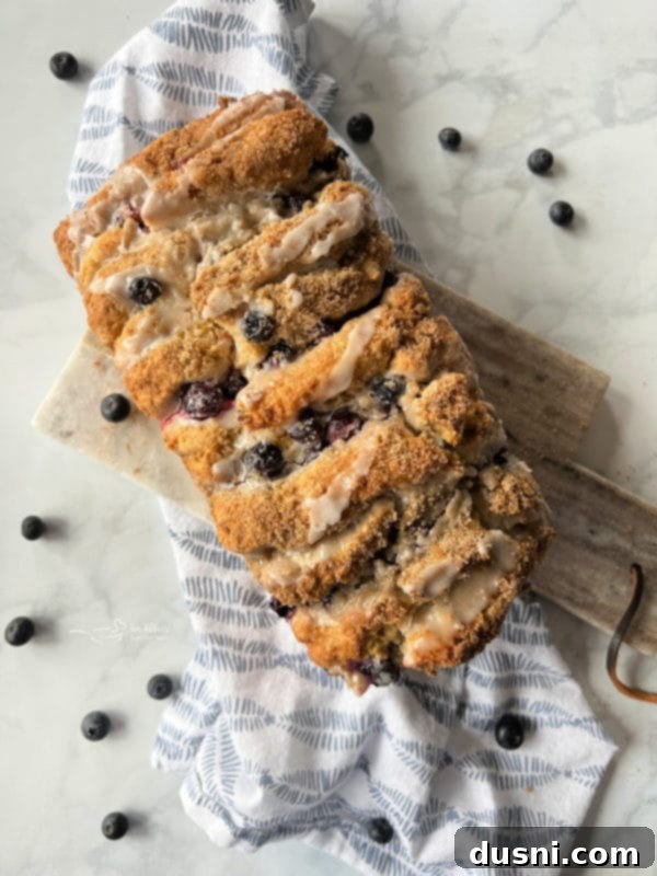 Blueberry Scone Loaf with a golden crust and a hint of lemon glaze.