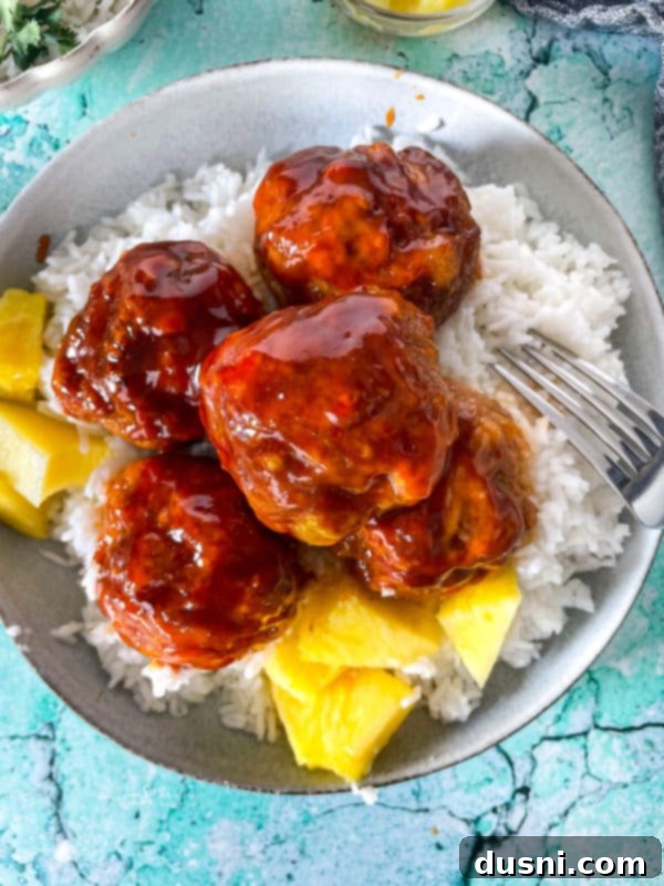 Savory Rice-Studded Meatballs 11 Close view of Hawaiian ham balls with pineapple sauce