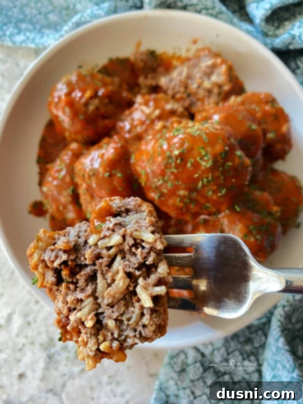 Savory Rice-Studded Meatballs 3 Close-up of cooked porcupine meatballs, showing the rice sticking out