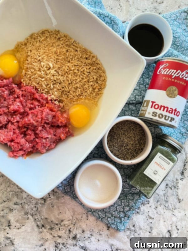 Savory Rice-Studded Meatballs 4 Ingredients for porcupine meatballs laid out on a table