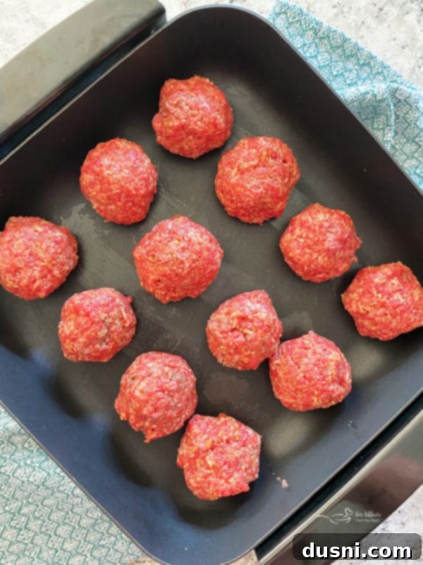Savory Rice-Studded Meatballs 5 Meatball mixture ready for cooking in a skillet