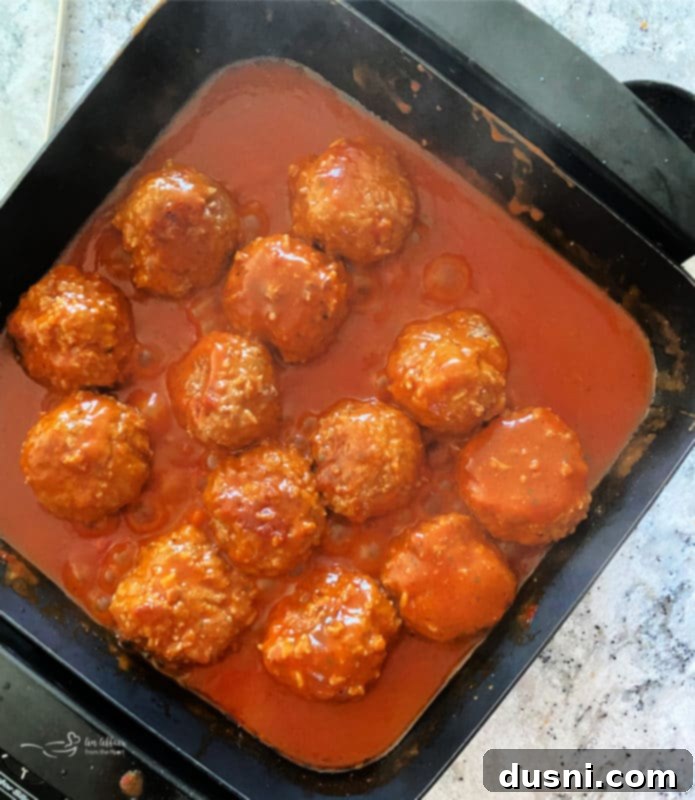 Savory Rice-Studded Meatballs 8 Baked porcupine meatballs in a dish, cooked to perfection