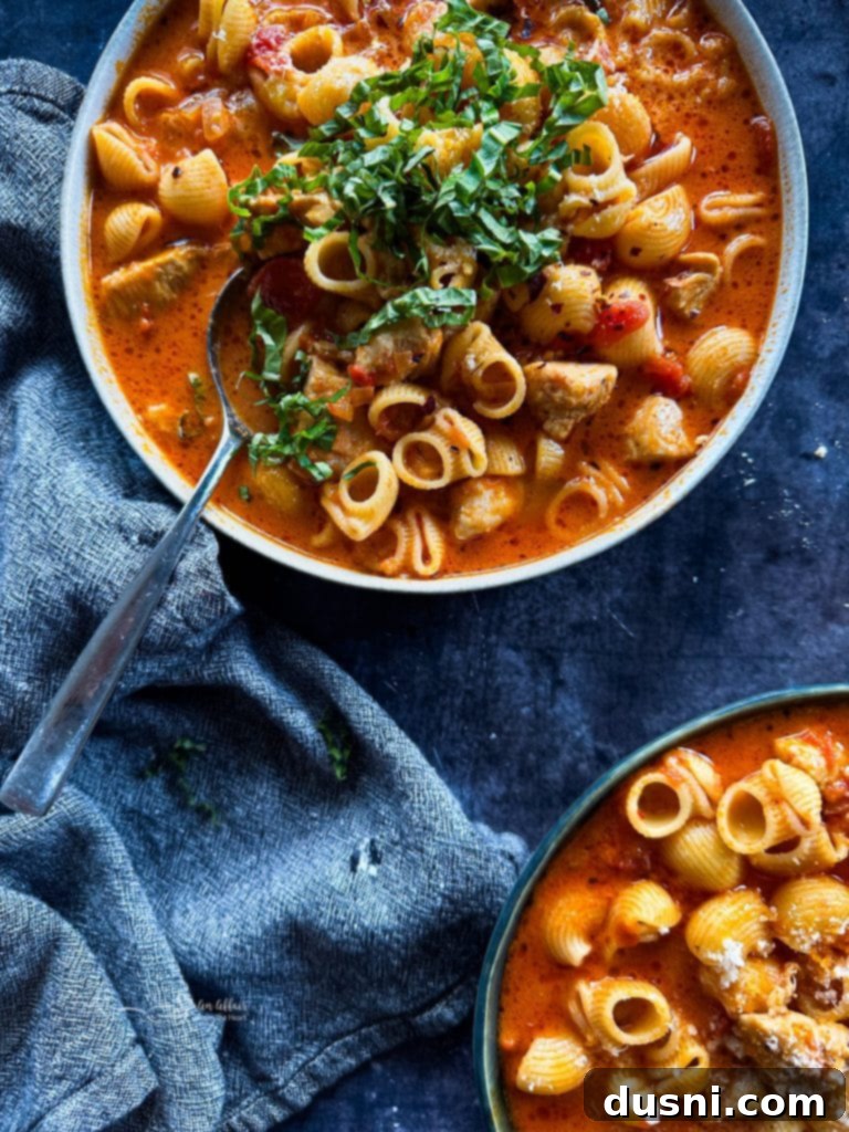 Coastal Crab & Shrimp Pasta 11 Close up of a creamy chicken parmesan soup, a comforting alternative pasta recipe.