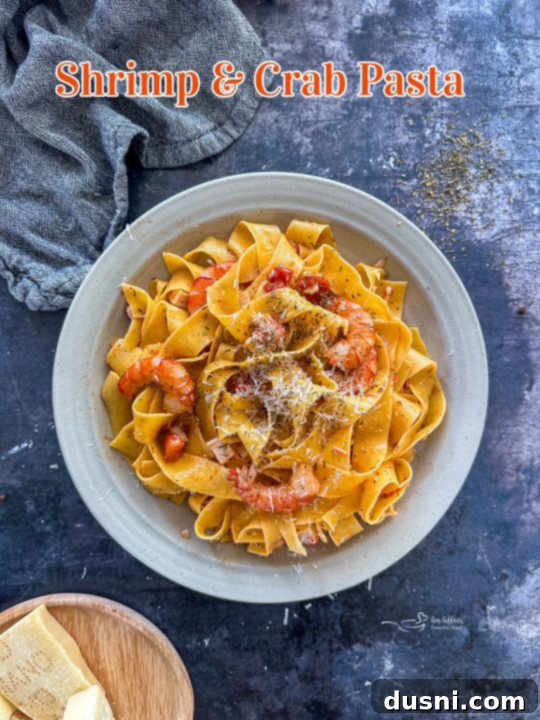 Coastal Crab & Shrimp Pasta 12 A beautifully presented bowl of creamy shrimp and crab pasta, ready to be enjoyed.