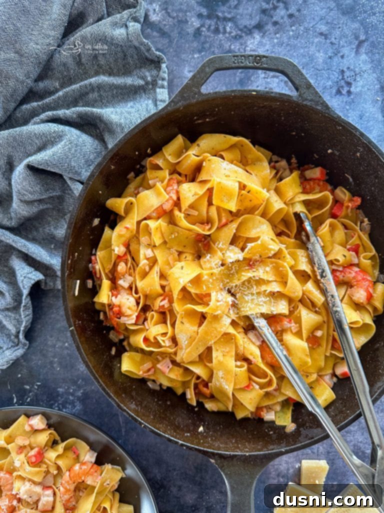 Coastal Crab & Shrimp Pasta 6 Close-up of minced garlic and diced onions sautéing in a skillet with butter and olive oil.