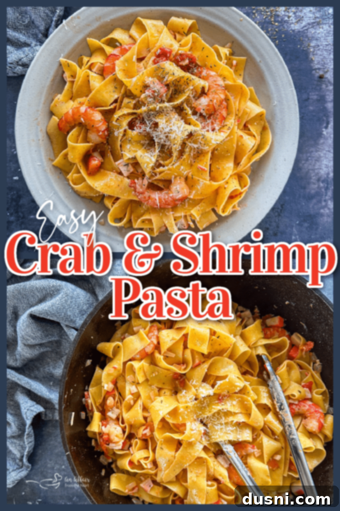 Coastal Crab & Shrimp Pasta 10 A large pot of shrimp and crab pasta ready to be served, garnished with fresh herbs.