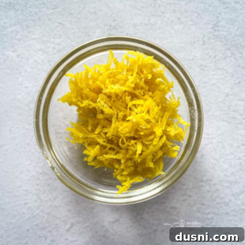 Lemon Blueberry Crumble Bliss 16 lemon zest in a bowl for lemon crumb bars