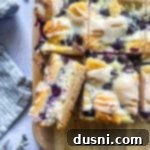 Lemon Blueberry Crumble Bliss 19 slice blueberry lemon crumb bar filled with cheesecake filling