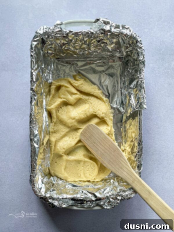 Lemon Blueberry Crumble Bliss 8 batter in pan for blueberry lemon crumble bars