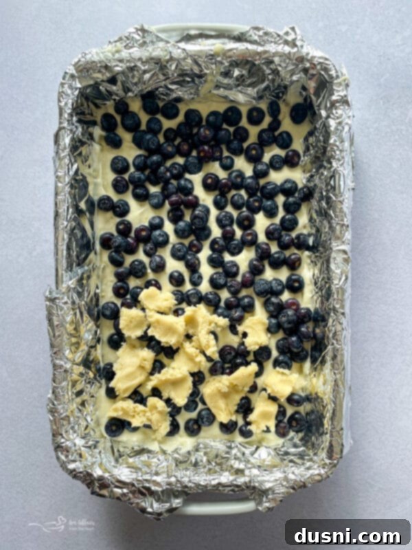 Lemon Blueberry Crumble Bliss 9 adding blueberries to unbaked cake mix