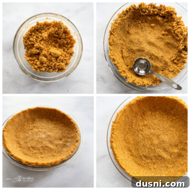 A close-up of graham cracker crumbs being mixed with melted butter and sugar in a bowl, preparing the pie crust