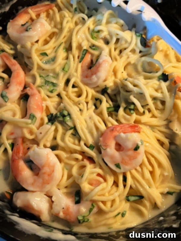 Bright Lemon Basil Creamy Shrimp Pasta 8 Serve hot, topped with more cheese.
