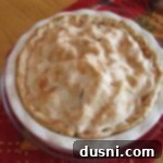 Overhead view of a beautiful Apple-Pear Pie in a white pie dish, ready to be served.