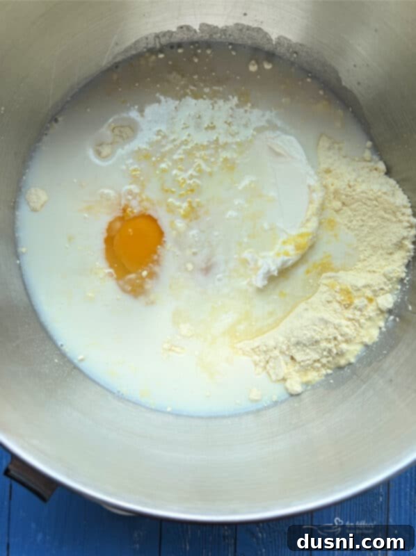 Luscious Lemon Cream Cheese Bundt Cake 9 Mixing the cake batter for a lemon bundt cake in a large bowl with an electric mixer