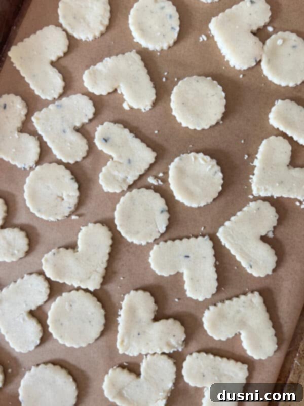 Lavender Shortbread and Lavender Strawberry Cream 16 Another view of heart-shaped lavender shortbread cookies on a baking sheet, showing their delicate form.
