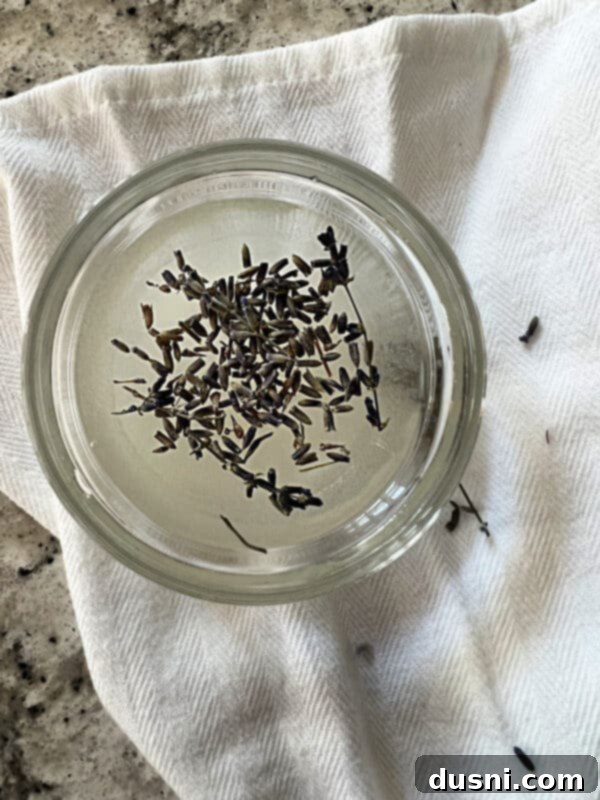 Lavender Shortbread and Lavender Strawberry Cream 18 Ingredients for lavender syrup: sugar, hot water, and dried lavender buds in separate small bowls.