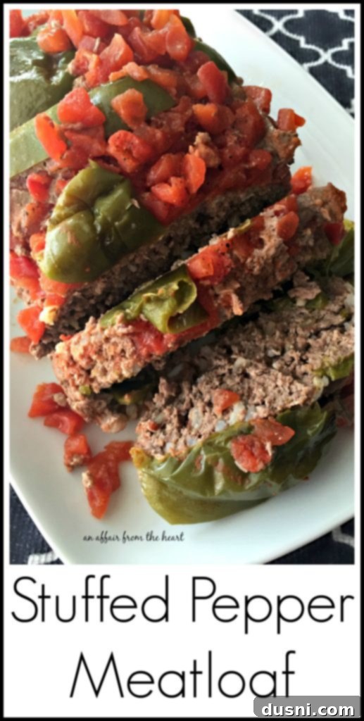 Bell Pepper Inspired Meatloaf 3 Stuffed Pepper Meatloaf on a white serving platter, ready to be sliced