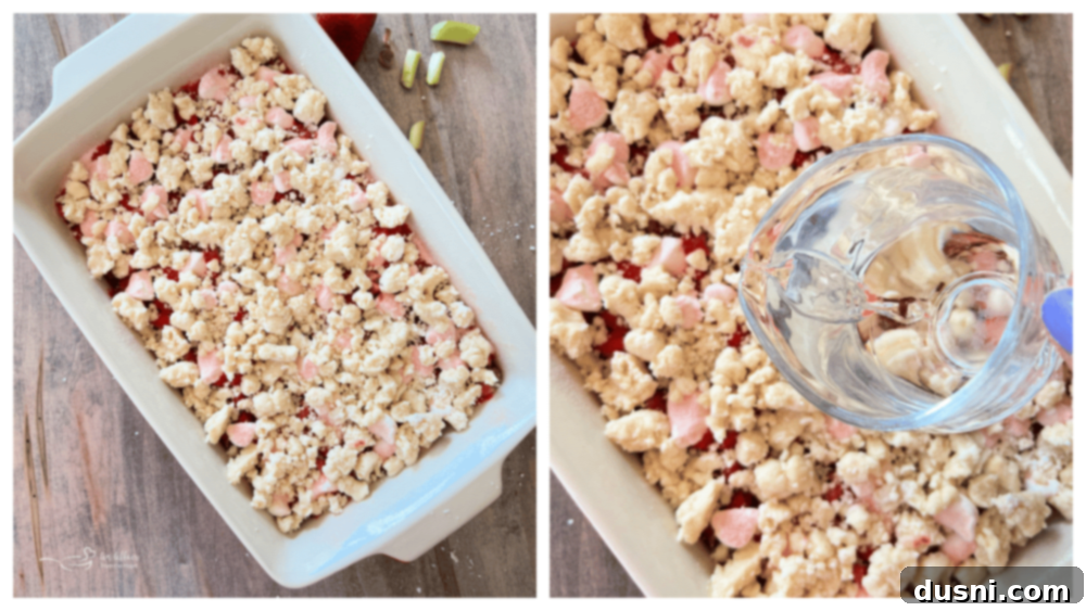 Strawberry Rhubarb Bliss 11 Pouring water over the assembled Strawberry Rhubarb Cobbler before baking