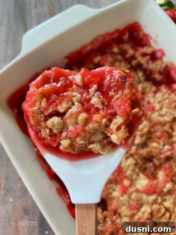 Strawberry Rhubarb Bliss 4 Close-up of a spoonful of Strawberry Rhubarb Cobbler