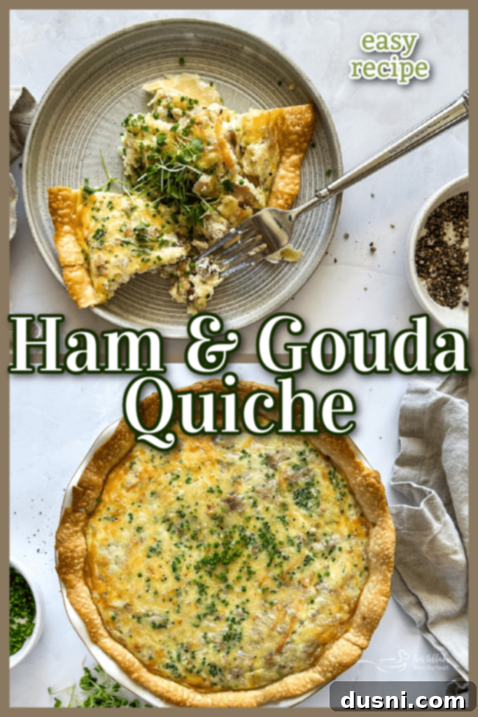 Savory Ham and Smoked Gouda Quiche 11 A large slice of Ham and Smoked Gouda Quiche on a white plate, garnished with fresh chives.