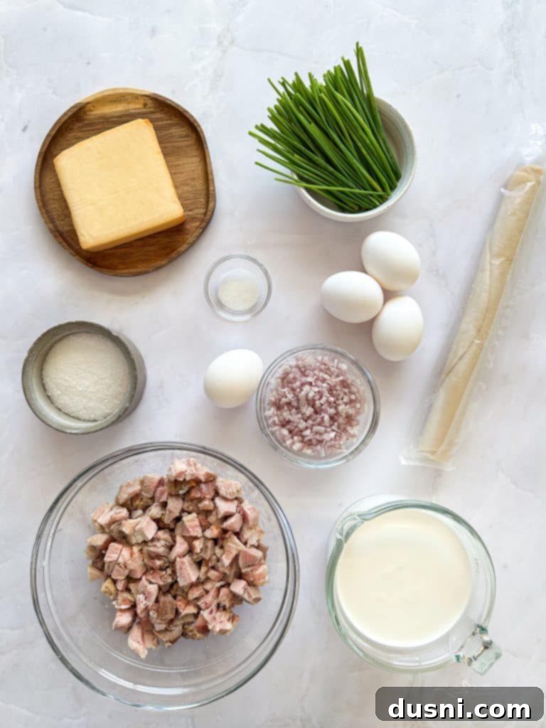 Savory Ham and Smoked Gouda Quiche 4 Close-up of a slice of Ham and Smoked Gouda Quiche showing the layers of ham and cheese.