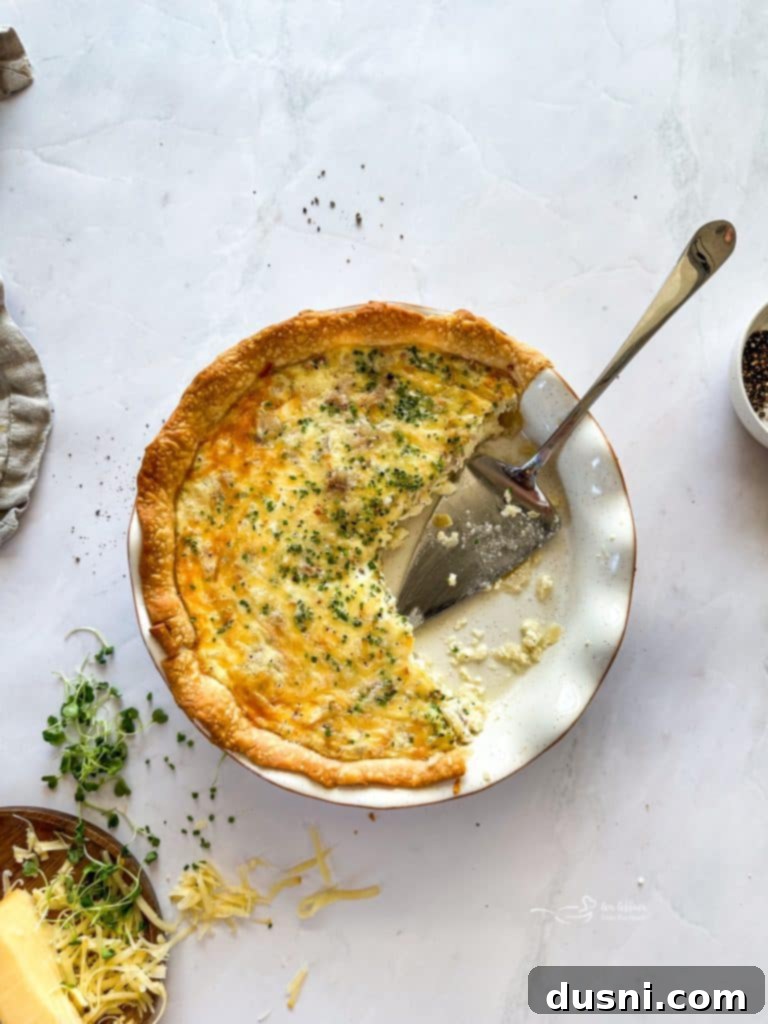 Savory Ham and Smoked Gouda Quiche 5 Ham and Smoked Gouda Quiche in a pie plate, freshly baked and golden.