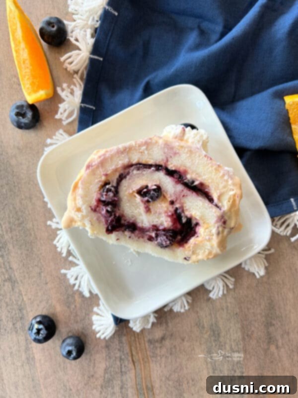 Blueberry Orange Cloud Roll 4 Full view of a gorgeous Blueberry Orange Angel Food Cake Roll, ready to be sliced.