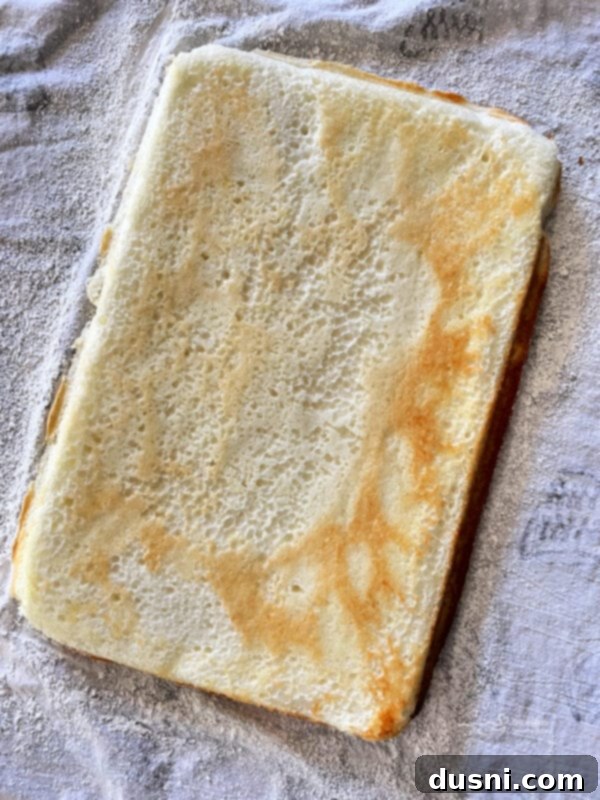 Blueberry Orange Cloud Roll 9 Baked angel food cake cooling in the pan before being flipped.