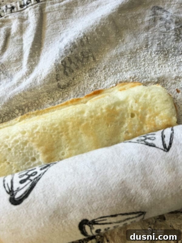 Blueberry Orange Cloud Roll 10 Warm angel food cake flipped onto a sugar-dusted towel.