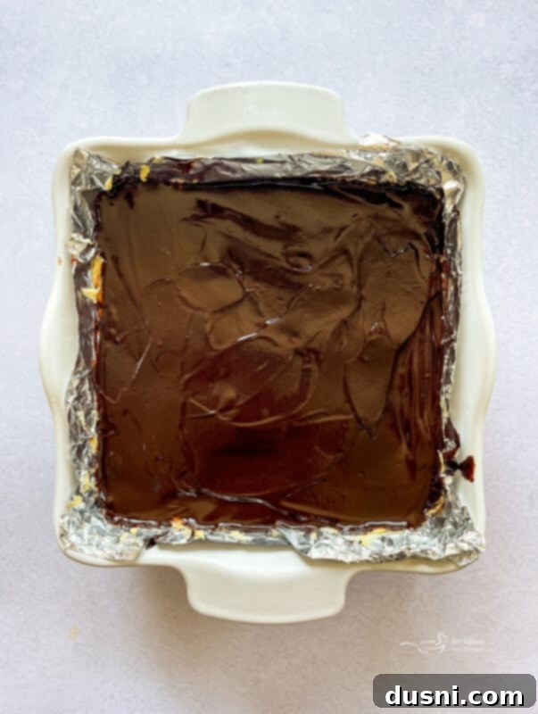 No-Bake Classic Nanaimo Bars 12 Semi-sweet chocolate and cream melting in a double boiler for Nanaimo bar topping