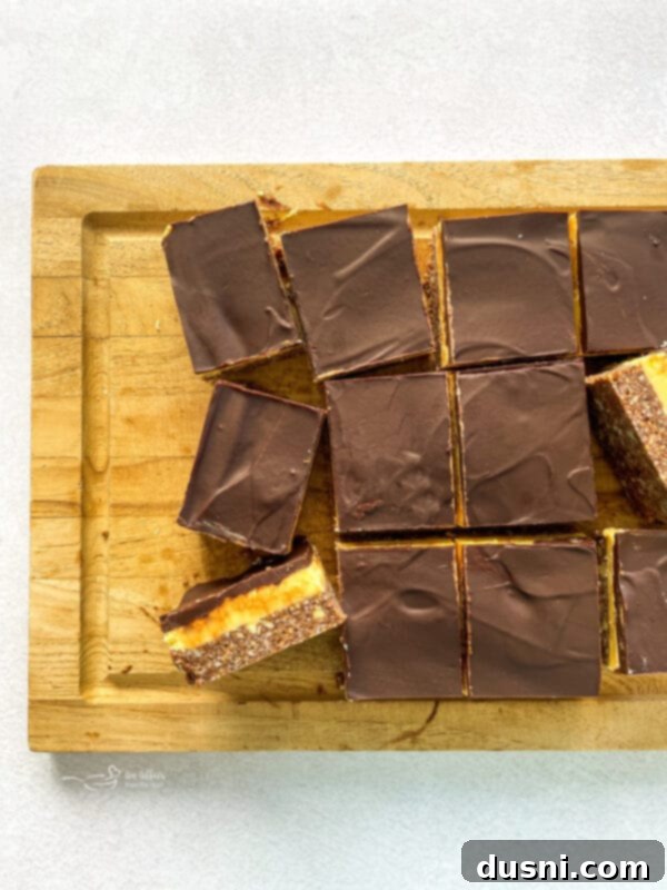 No-Bake Classic Nanaimo Bars 17 Close-up of a single Nanaimo bar square showing all three layers