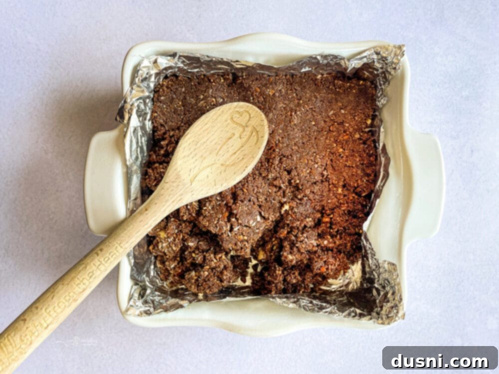 No-Bake Classic Nanaimo Bars 9 Mixture for the Nanaimo bar base with graham cracker crumbs, coconut, and pecans