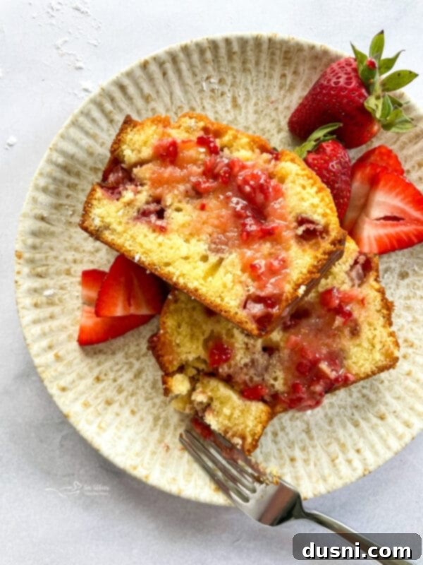 Delicious Glazed Strawberry Bread with a vibrant strawberry glaze, perfect for a spring or summer brunch.