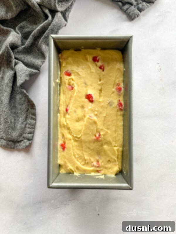 Strawberry bread batter in a loaf pan, ready for baking.