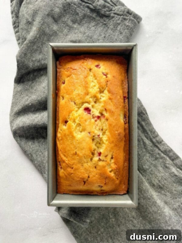 Freshly baked strawberry bread cooling in the loaf pan.